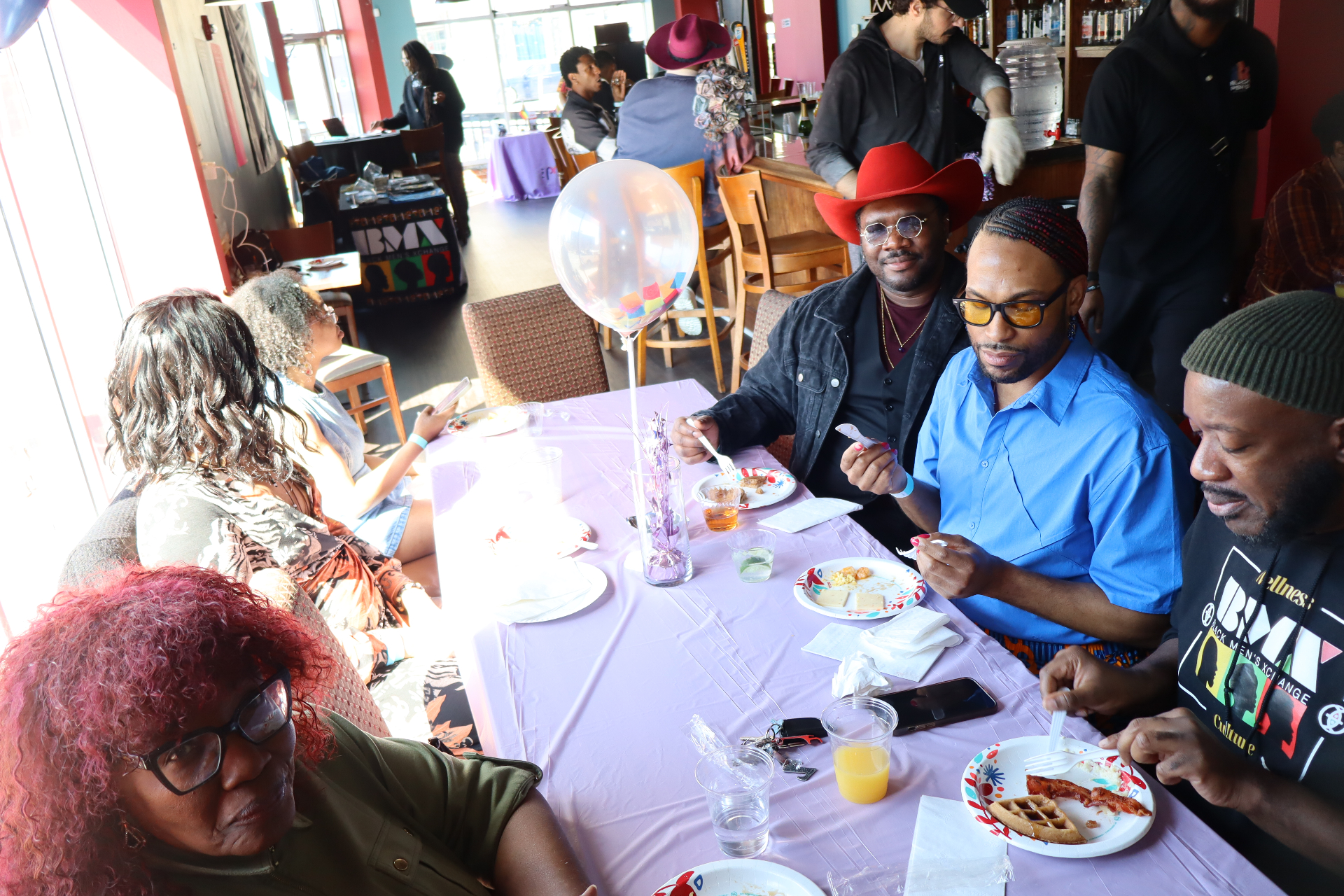 Brunch table with BMX guests sharing a meal
