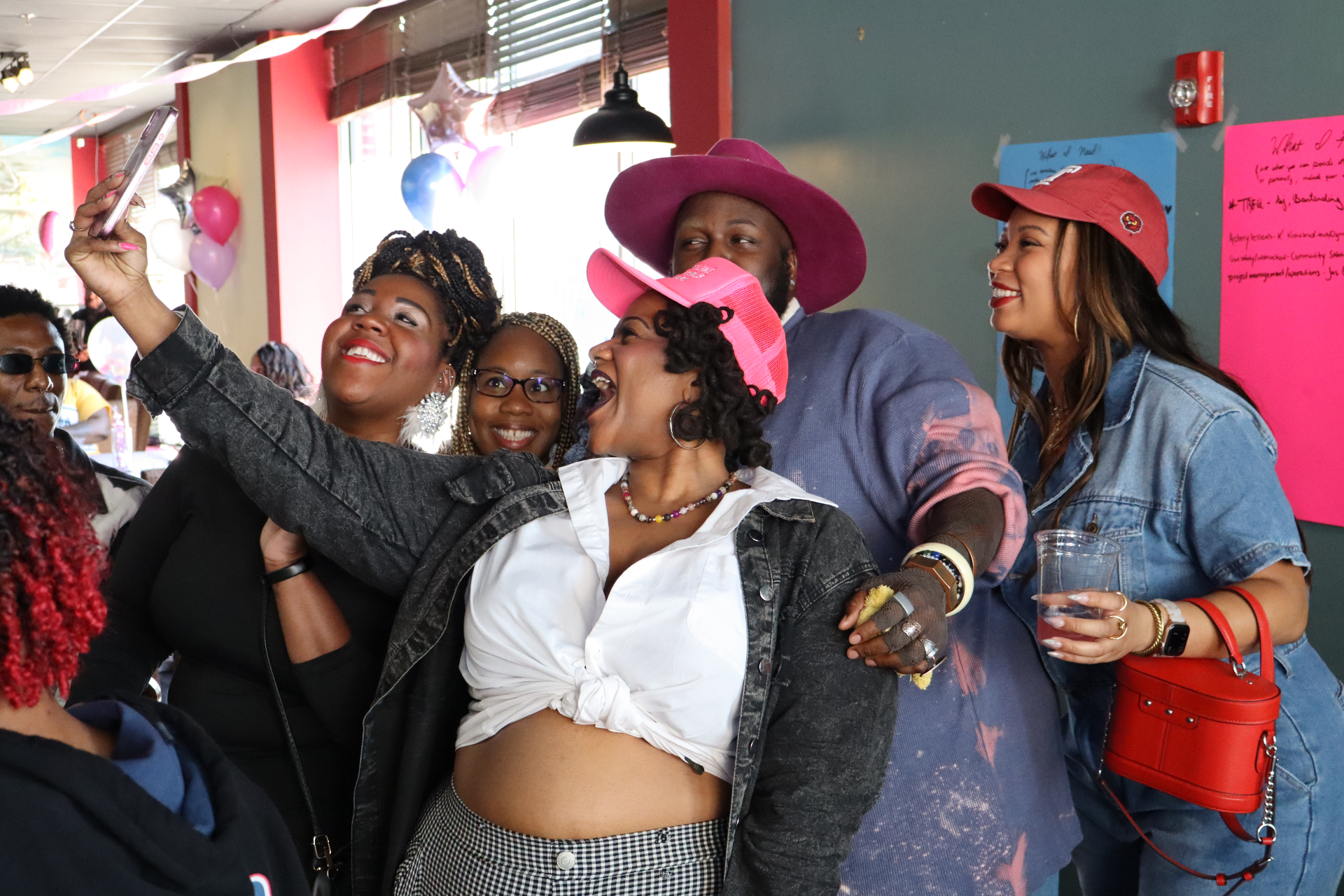 Attendees taking a group selfie at Soul Brunch